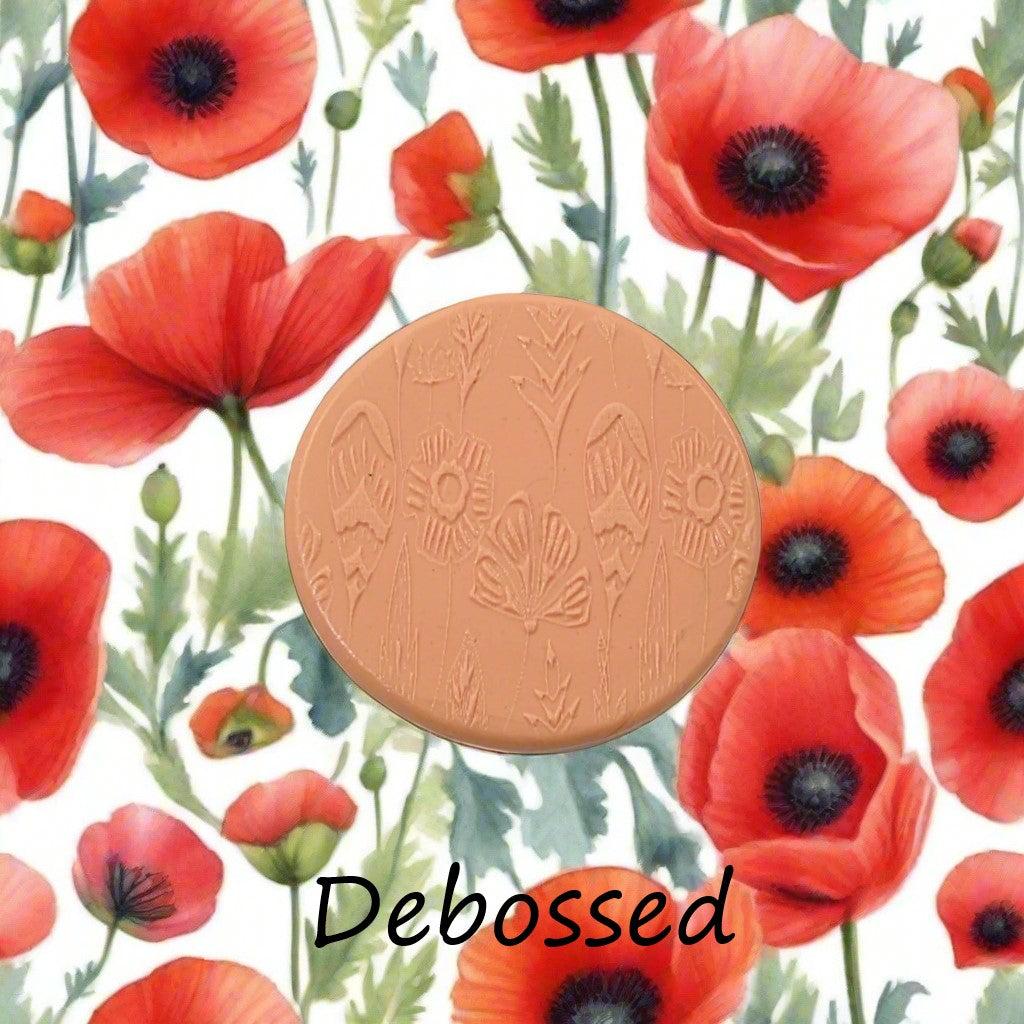 Flowers embossed in silly putty Using a debossed texture mat. This will give you an idea of what it will look like on metal clay or polymer clay