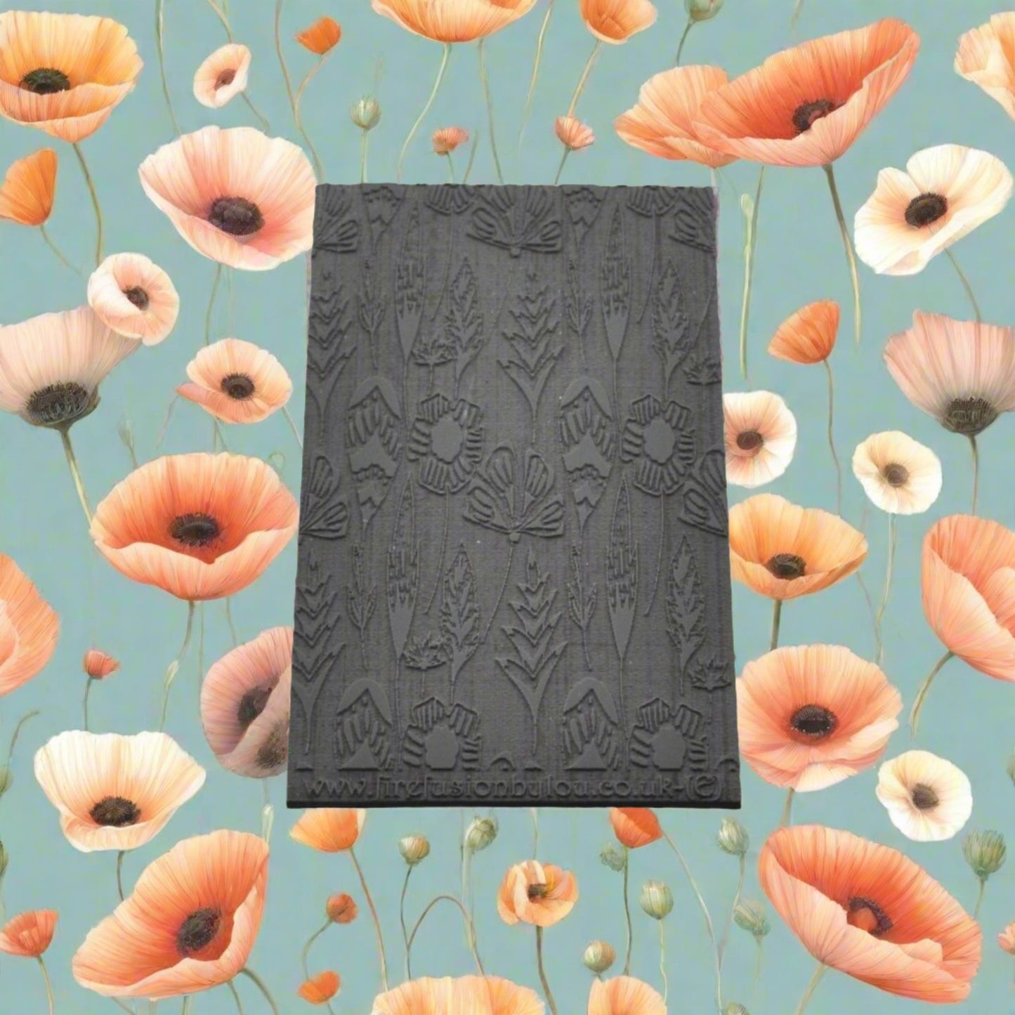 A 95 x 55 mm embossed texture mat with a flower design. Use to make a embossed impression on metal clay and polymer clay.