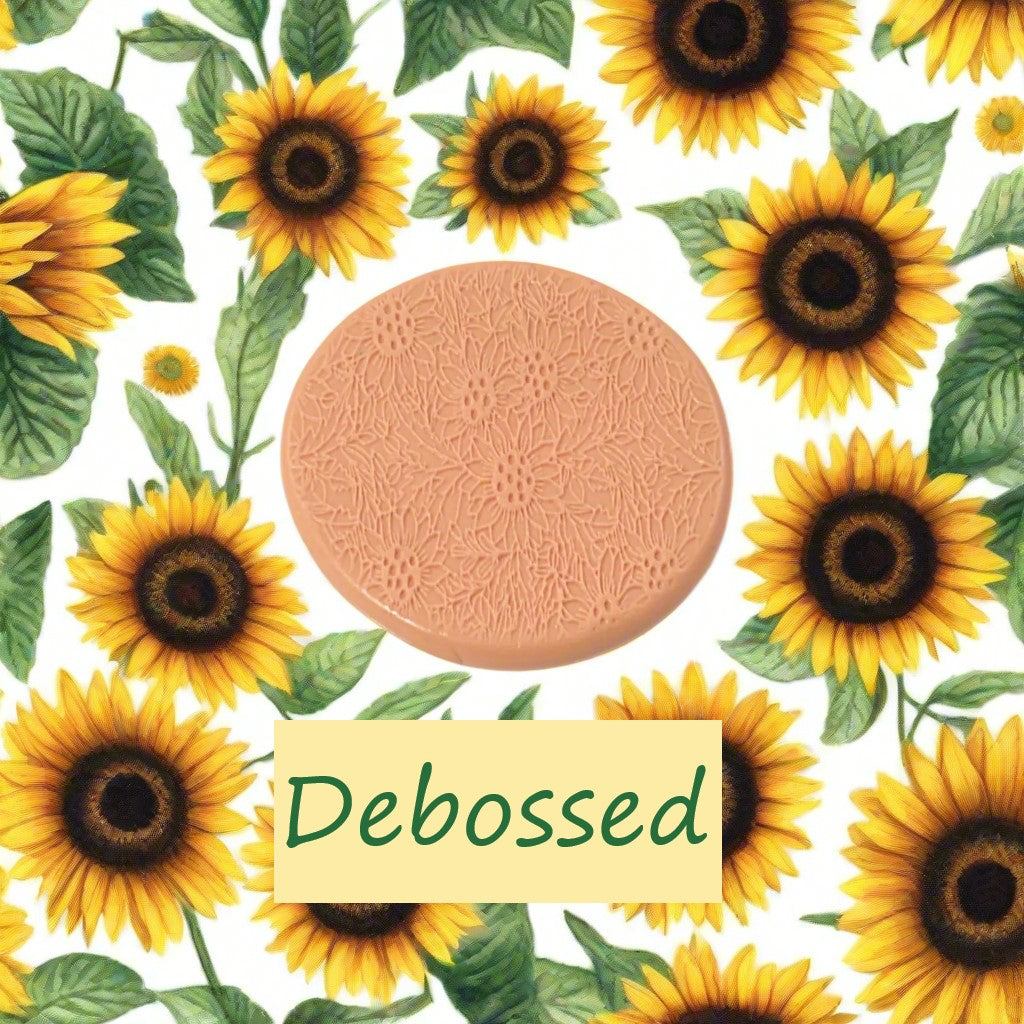 A small sunflower pattern embossed in silly putty Using a small sunflower patterned debossed texture mat in grey material. This will give you an idea of what it will look like on metal clay or polymer clay.