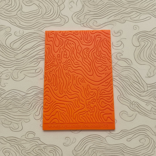 A pattern debossed texture mat. This texture mat will give you an embossed effect on metal clay or polymer clay.