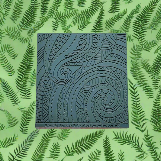 A pattern debossed texture mat in grey material. This texture mat will give you an embossed effect on metal clay or polymer clay.