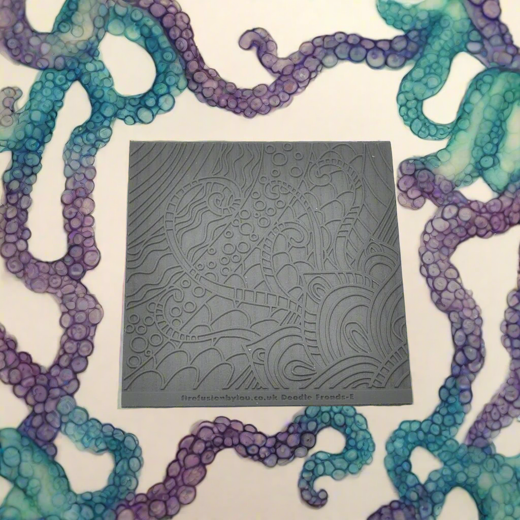 A pattern embossed texture mat in grey material. This texture mat will give you a debossed effect on metal clay or polymer clay.