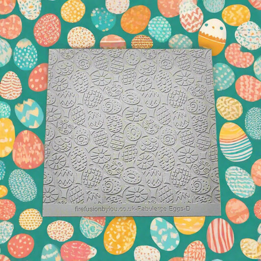 A repeating pattern debossed texture mat in grey material. This texture mat will give you an embossed effect on metal clay or polymer clay.