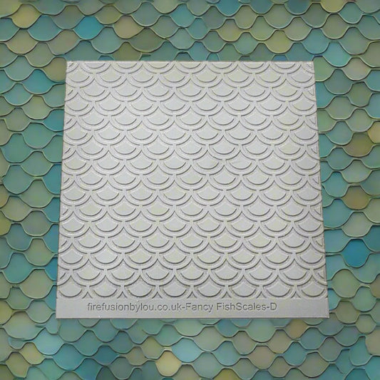 A fish scale pattern debossed texture mat in grey material. This texture mat will give you an embossed effect on metal clay or polymer clay.