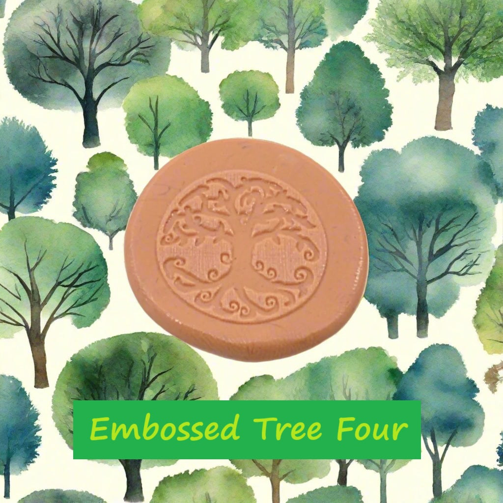 A tree debossed in silly putty Using a embossed texture mat in grey material. This will give you an idea of what it will look like on metal clay or polymer clay