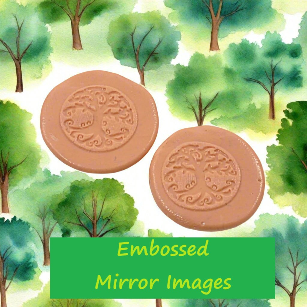 A tree debossed in silly putty Using a embossed texture mat in grey material. This will give you an idea of what it will look like on metal clay or polymer clay