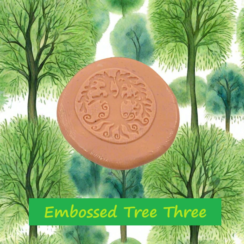 A tree debossed in silly putty Using a embossed texture mat in grey material. This will give you an idea of what it will look like on metal clay or polymer clay