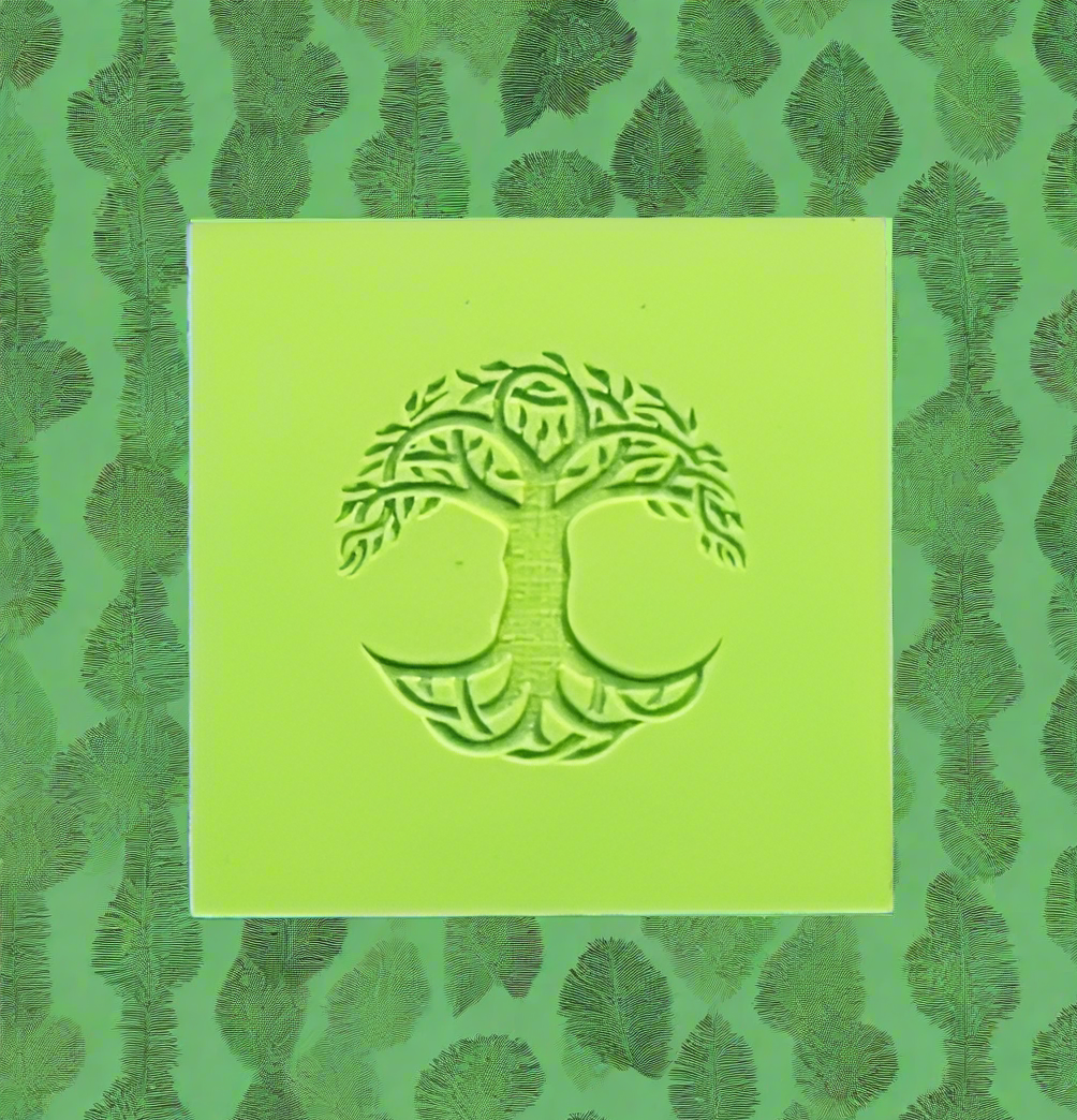 Green embossed rubber with a tree design on a green leafy patterned background