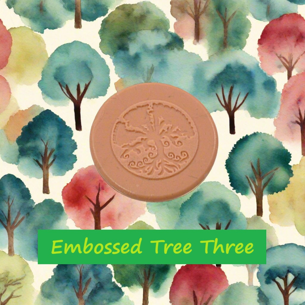 A tree debossed in silly putty Using a embossed texture mat in grey material. This will give you an idea of what it will look like on metal clay or polymer clay