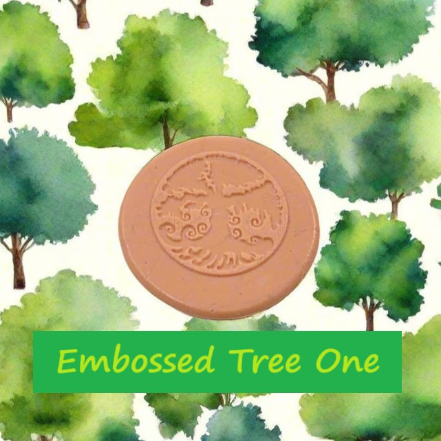 A tree debossed in silly putty Using a embossed texture mat in grey material. This will give you an idea of what it will look like on metal clay or polymer clay