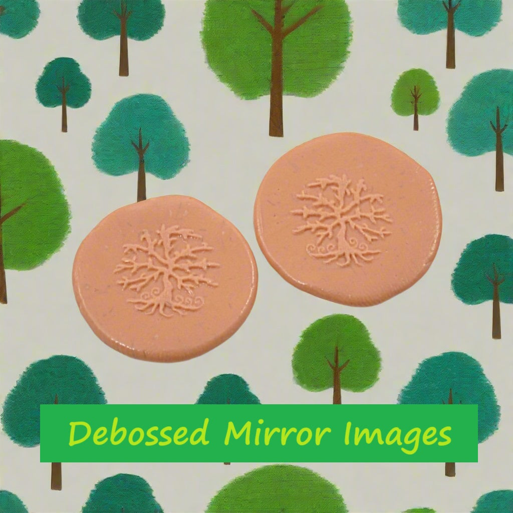A tree embossed in silly putty Using a debossed texture mat in grey material. Mirror images. This will give you an idea of what it will look like on metal clay or polymer clay