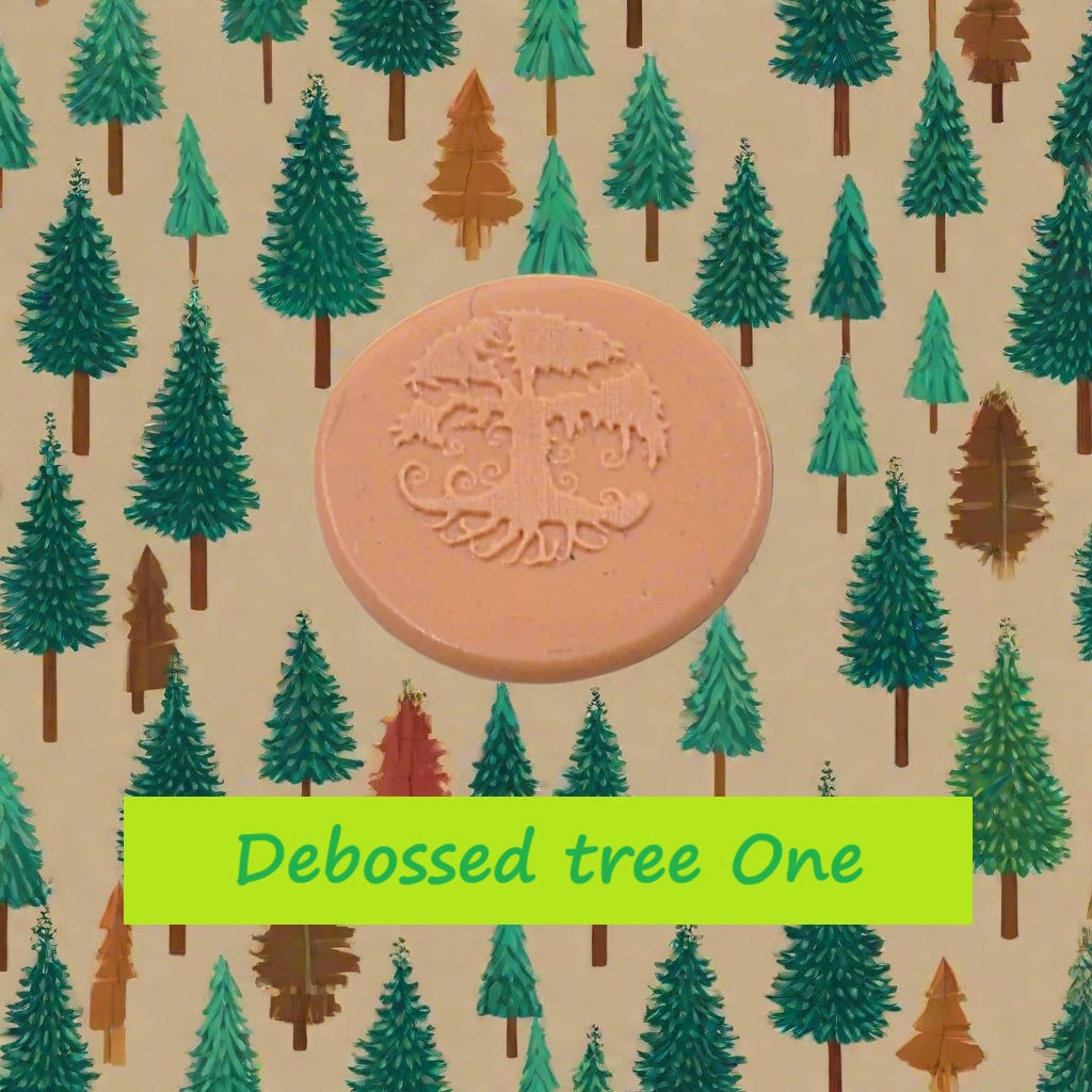 A tree embossed in silly putty Using a debossed texture mat in grey material. This will give you an idea of what it will look like on metal clay or polymer clay