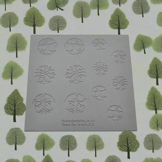 A 100 x 100 millimetre embossed texture mat with seven tree designs and two sizes. use to make an impression on metal clay and polymer clay.