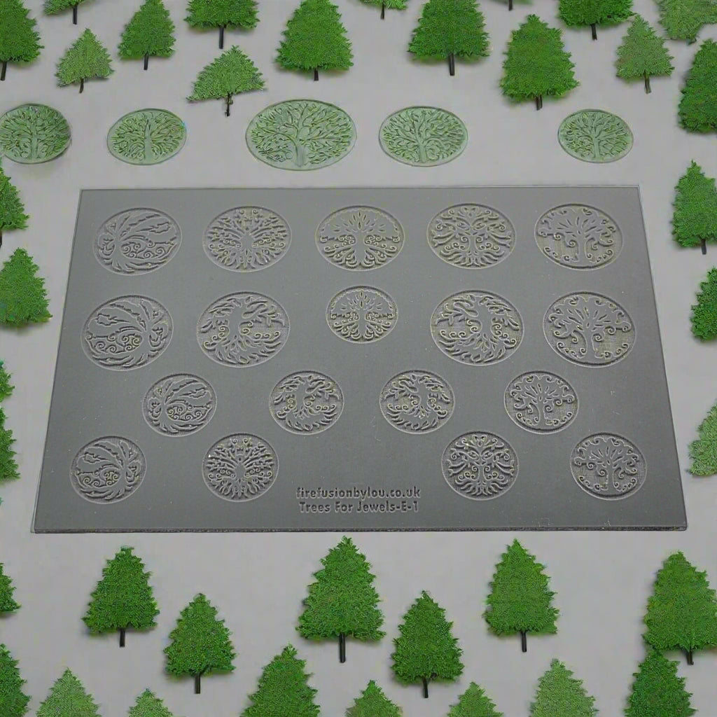 A 145 x 100 mm texture mat with seven tree designs and two sizes. use to make an impression on metal clay and polymer clay.