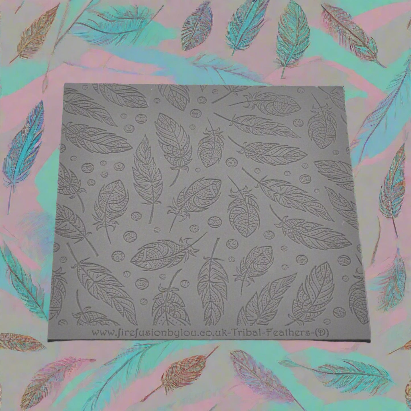 A tribal feather pattern debossed texture mat in grey material. This texture mat will give you an embossed effect on metal clay or polymer clay.