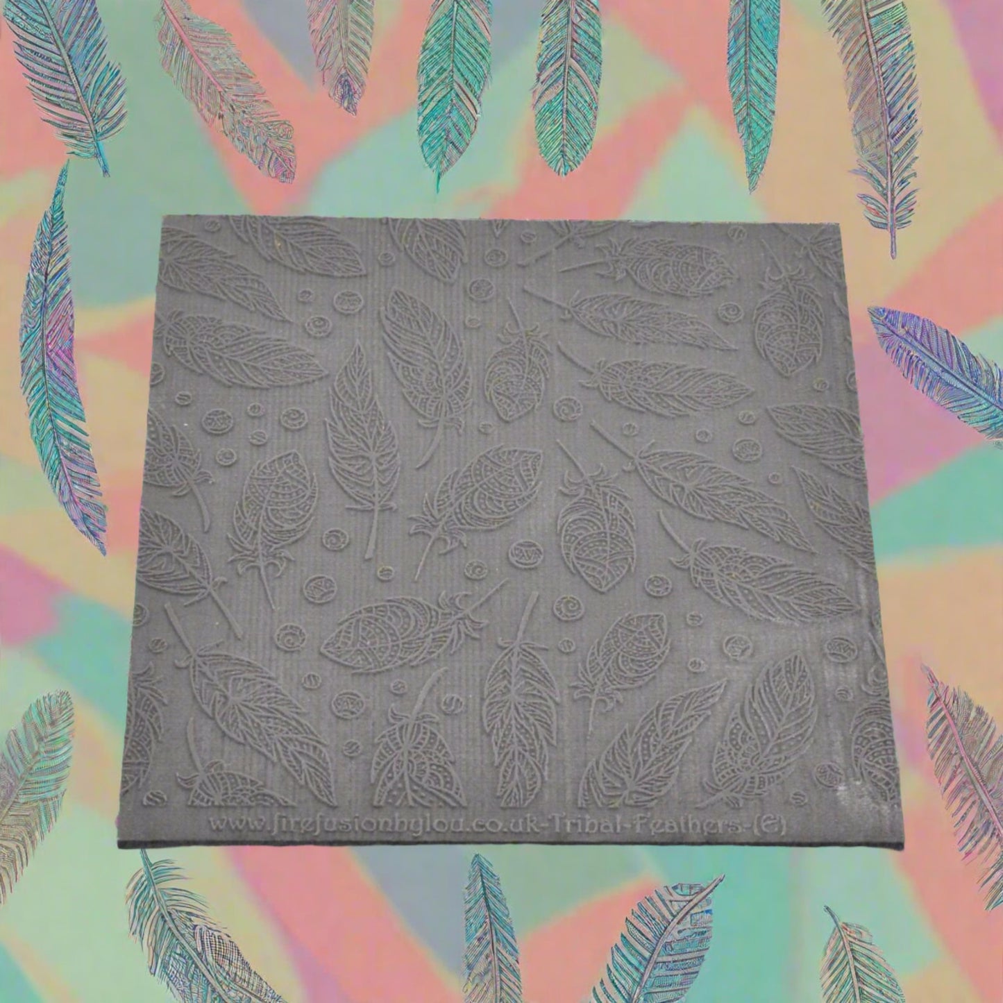 A tribal feather pattern debossed texture mat in grey material. This texture mat will give you an embossed effect on metal clay or polymer clay.