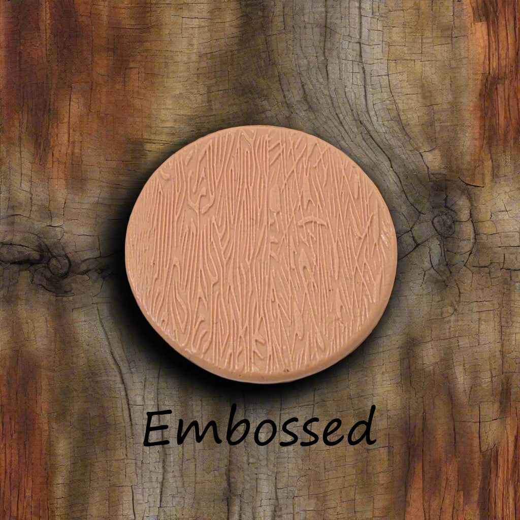 Tree bark designs debossed in silly putty Using a debossed texture mat. This will give you an idea of what it will look like on metal clay or polymer clay.