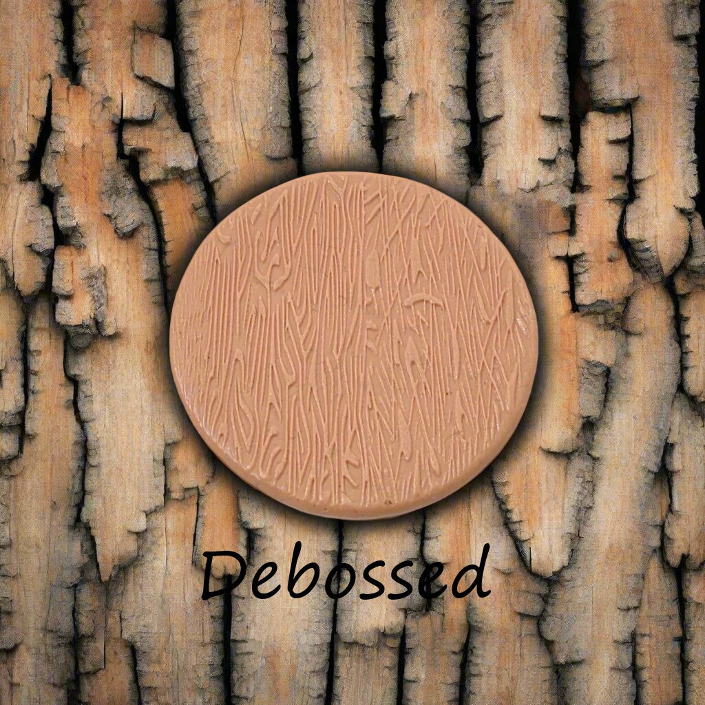 Tree bark designs embossed in silly putty Using a debossed texture mat. This will give you an idea of what it will look like on metal clay or polymer clay.