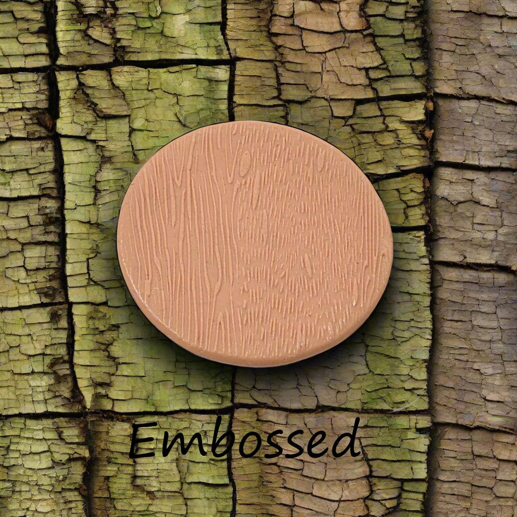 Tree bark designs debossed in silly putty Using a debossed texture mat. This will give you an idea of what it will look like on metal clay or polymer clay.