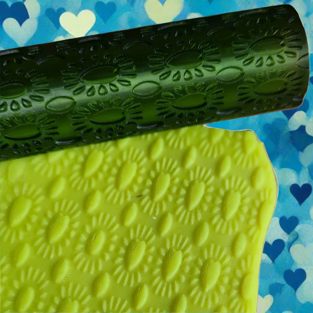 A Capulet Heart texture roller pattern rolled in green polymer.