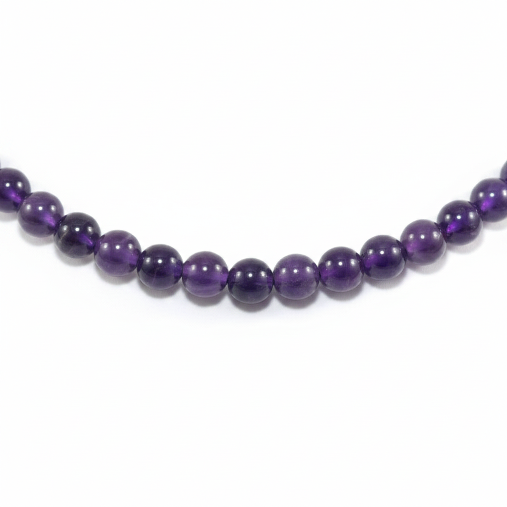 Necklace with purple beads on a white background