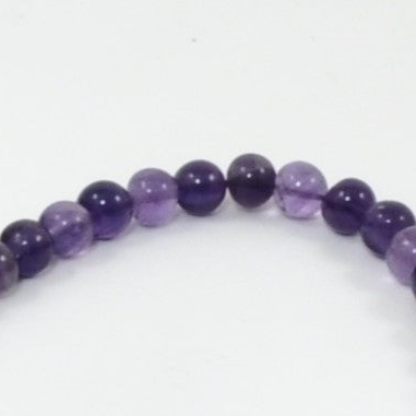 Purple beaded on a white background