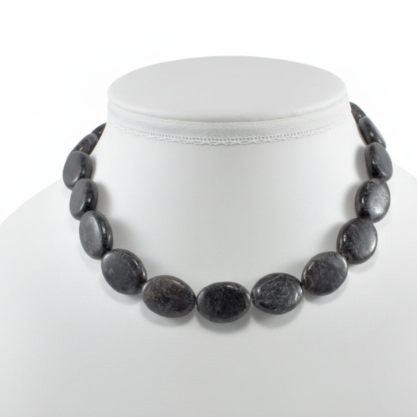  "Arfvedsonite oval beads 18x14mm with metallic shimmer on white background"