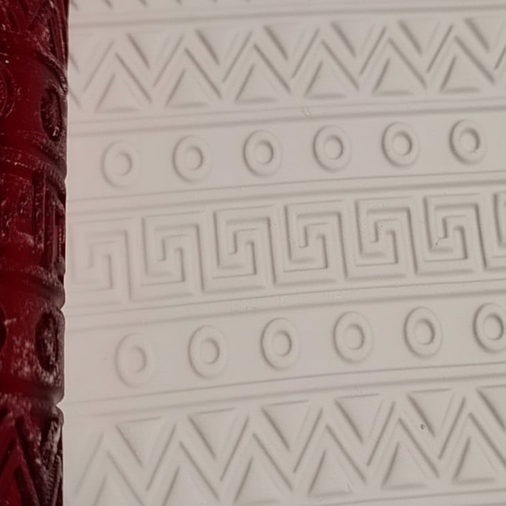 Close-up of a textured surface with geometric patterns on a white background