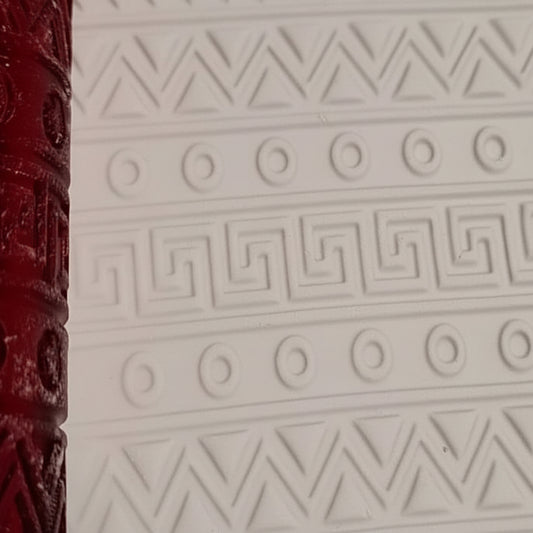 Close-up of a textured surface with geometric patterns on a white background