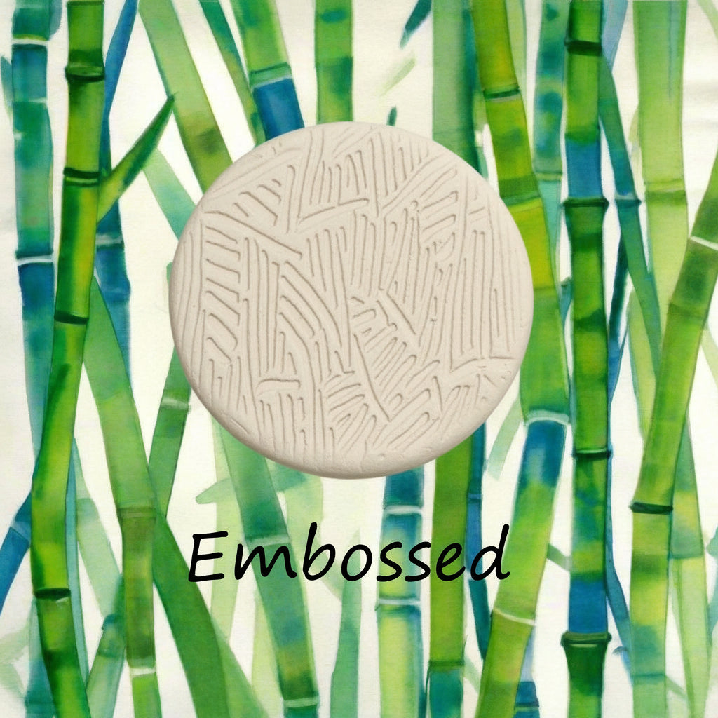A pattern debossed in clay using a patterned embossed texture mat.