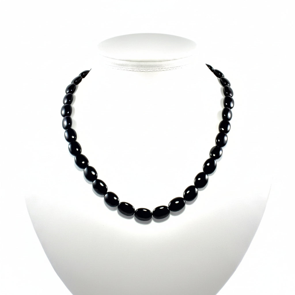 "Black agate flat oval beads 13x9mm on 14 inch strand showing smooth polished finish and oval shape"