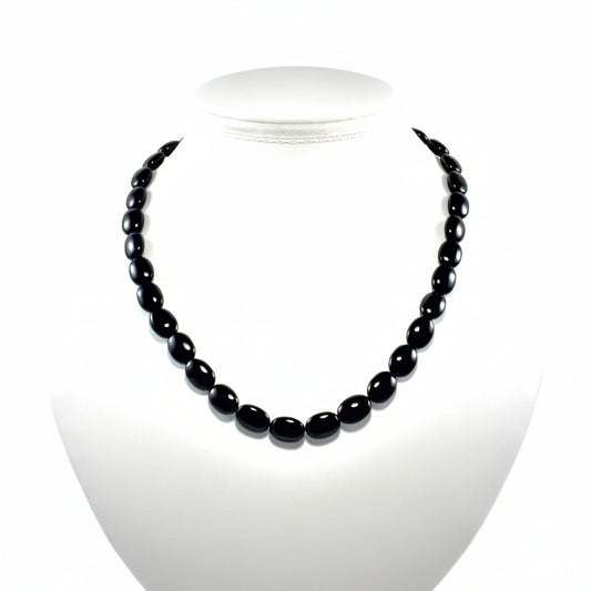 "Black agate flat oval beads 13x9mm on 14 inch strand showing smooth polished finish and oval shape"