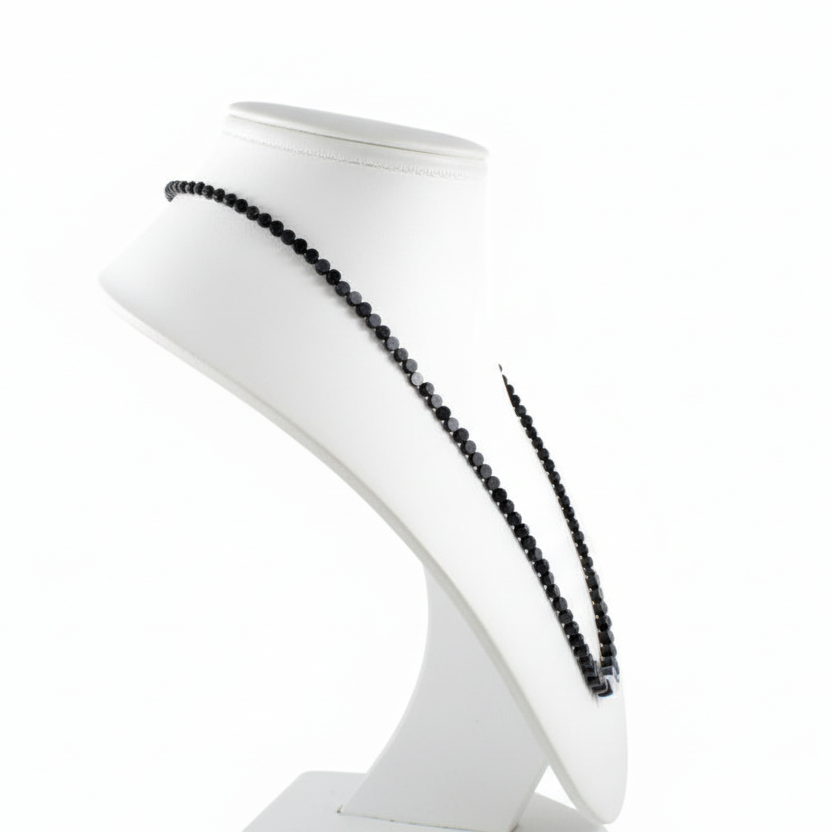 White bust with black decorative agate coins on a white background