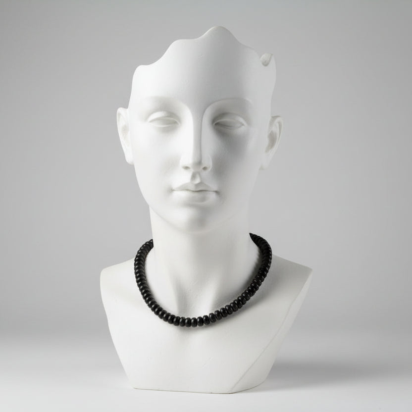 "Black agate rondelle beads 7x4mm on 13 inch strand showing smooth disc shape and deep black colour"