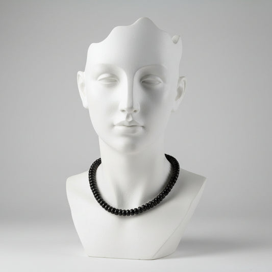 "Black agate rondelle beads 7x4mm on 13 inch strand showing smooth disc shape and deep black colour"