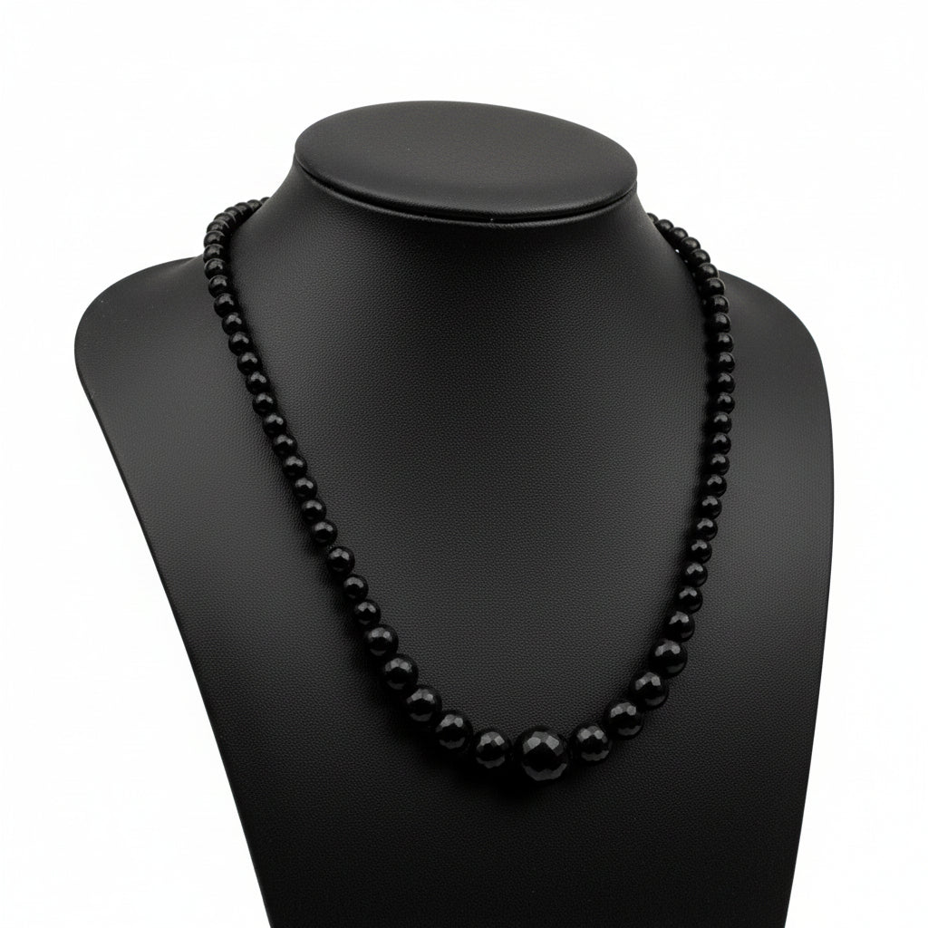 "Black Agate faceted graduated round beads 14-16mm with sparkling finish on white background"