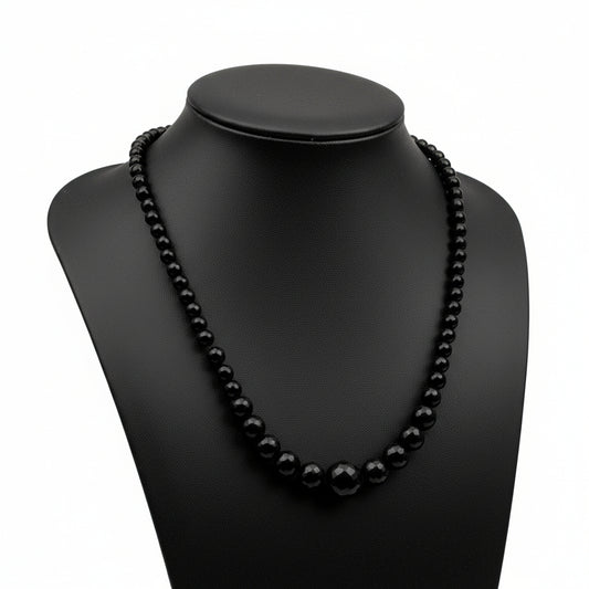 "Black Agate faceted graduated round beads 14-16mm with sparkling finish on white background"