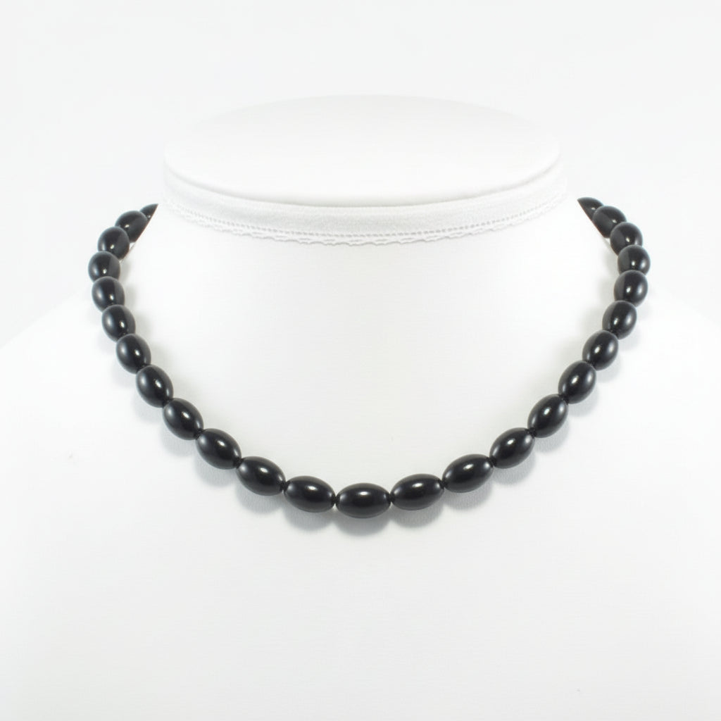 "Black Agate rice beads 11x8mm on white background"