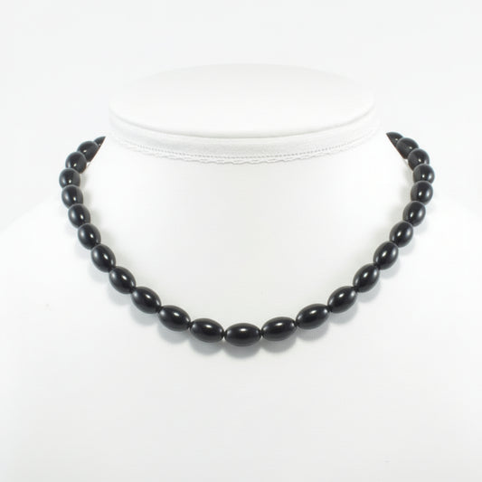 "Black Agate rice beads 11x8mm on white background"