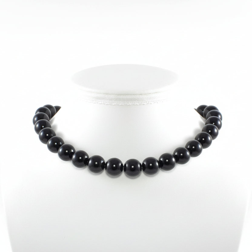 "Black Agate round beads 14mm with glossy finish on white background"