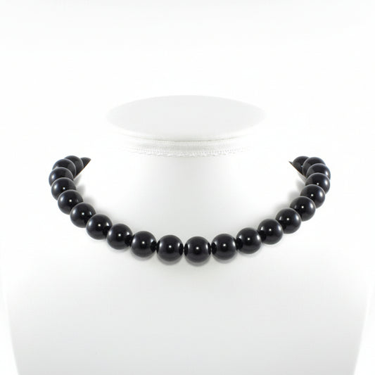 "Black Agate round beads 14mm with glossy finish on white background"