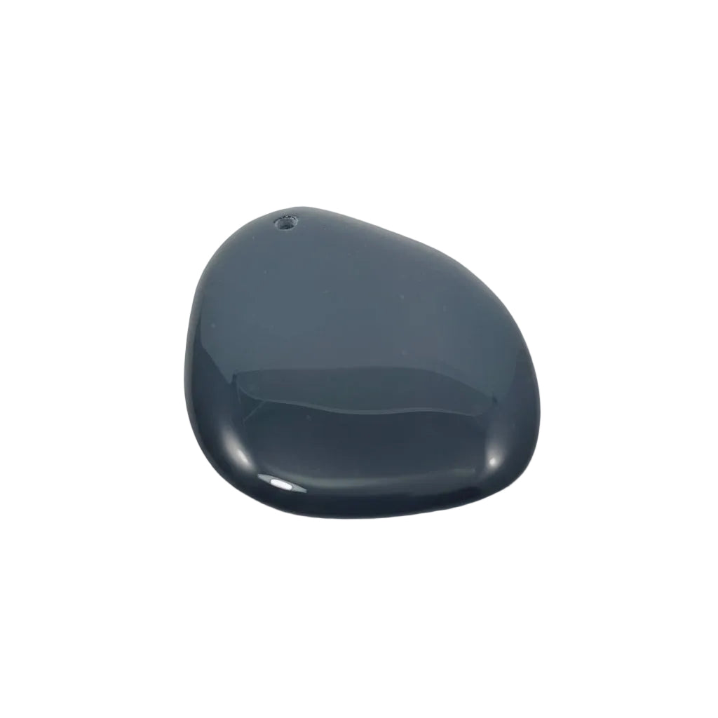 Teardrop-shaped dark black stone on a light background
