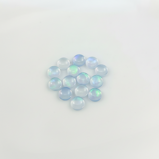 Blue Opal with green fire on a light background
