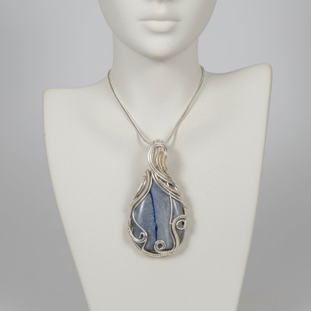 Gray stone with a blue line on a light gray background