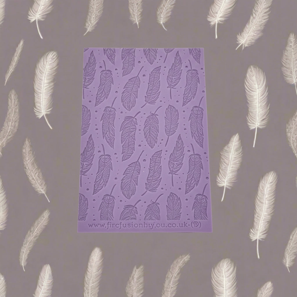 A feather pattern debossed texture mat. This texture mat will give you an embossed effect on metal clay or polymer clay.