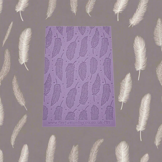 A feather pattern debossed texture mat. This texture mat will give you an embossed effect on metal clay or polymer clay.