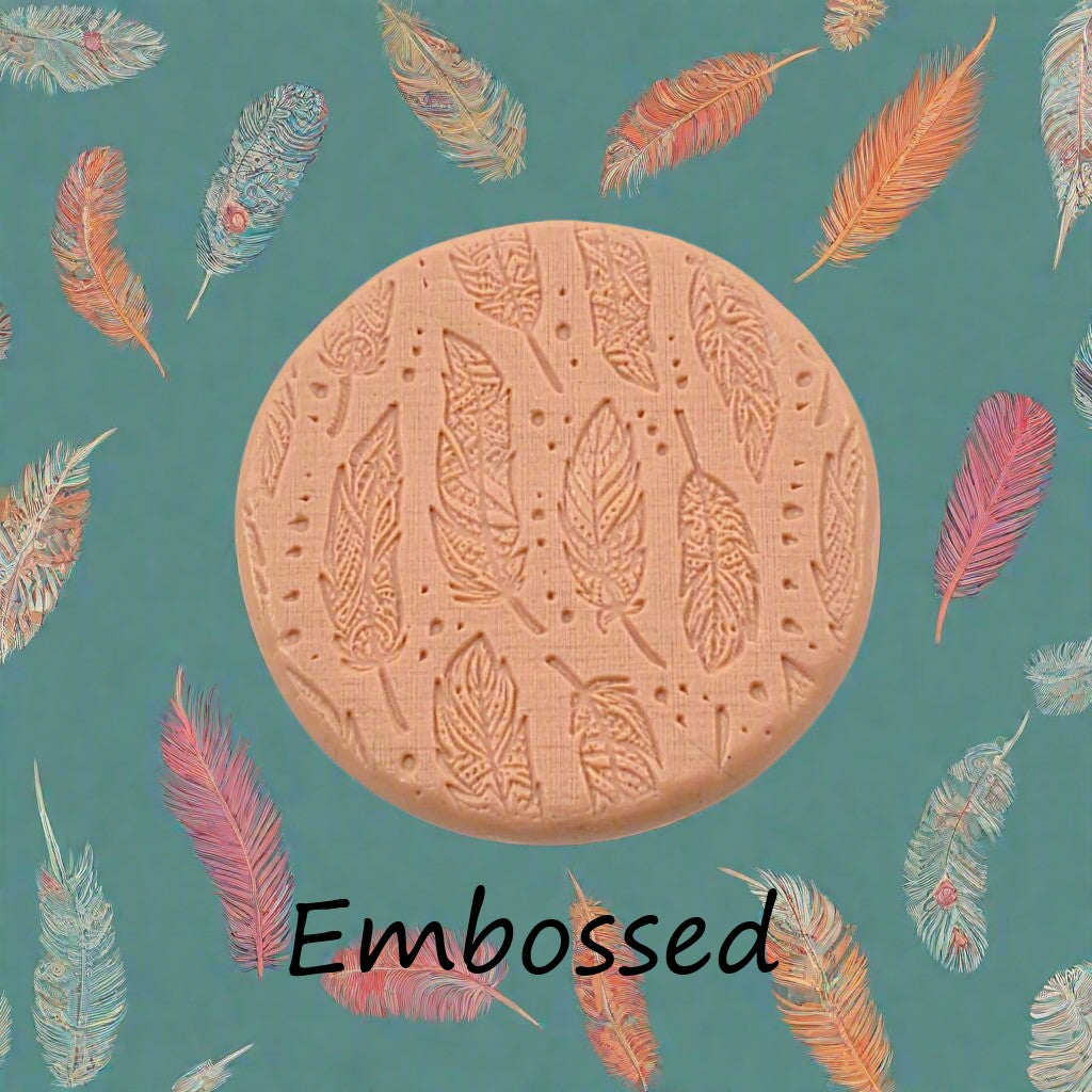 Boho Feathers design debossed in silly putty Using a  embossed texture mat. This will give you an idea of what it will look like on metal clay or polymer clay.
