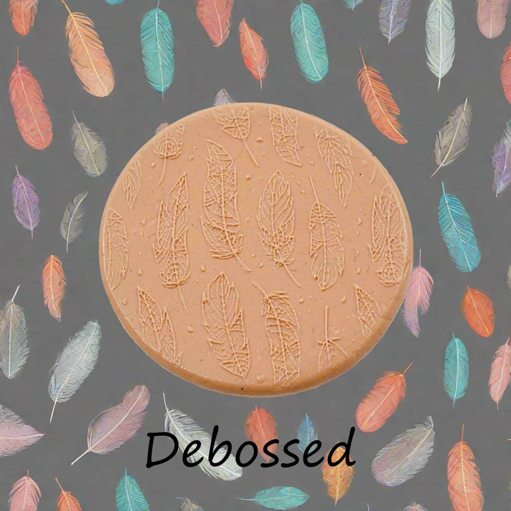 Boho Feathers design embossed in silly putty Using a  debossed texture mat. This will give you an idea of what it will look like on metal clay or polymer clay.