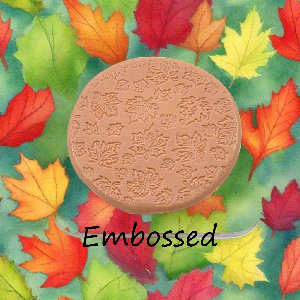 Canadian Leaves debossed in silly putty Using a  embossed texture mat. This will give you an idea of what it will look like on metal clay or polymer clay