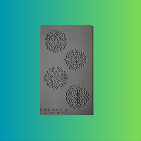 A grey rectangular rubber stamp featuring four Celtic knot and floral mandala designs, shown against a vibrant green-to-blue gradient background.